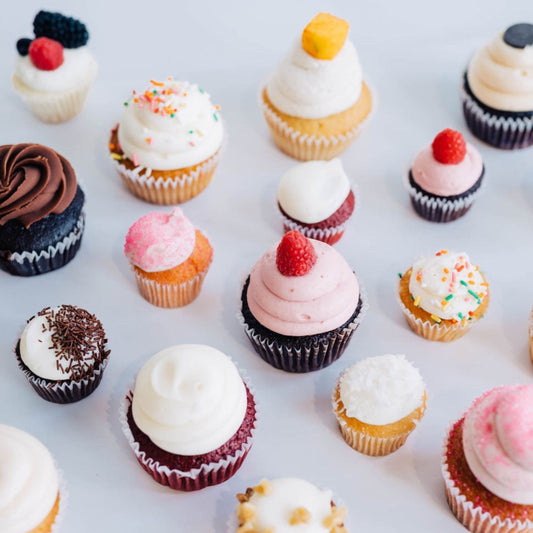 assortment of different flavored cupcakes